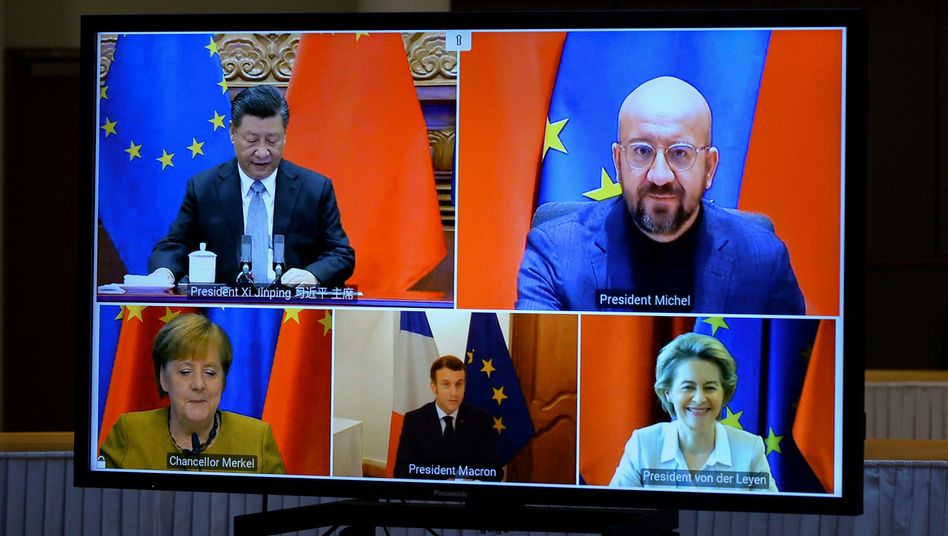 A screen shot of a Dec. 30, 2021, video summit including Chinese President Xi Jinping, European Council President Charles Michel, German Chancellor Angela Merkel, French President Emmanuel Macron and European Commission President Ursula von der Leyen.